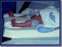 The splayed toes of a terrorized child struggling to break free- adult torture victim pose